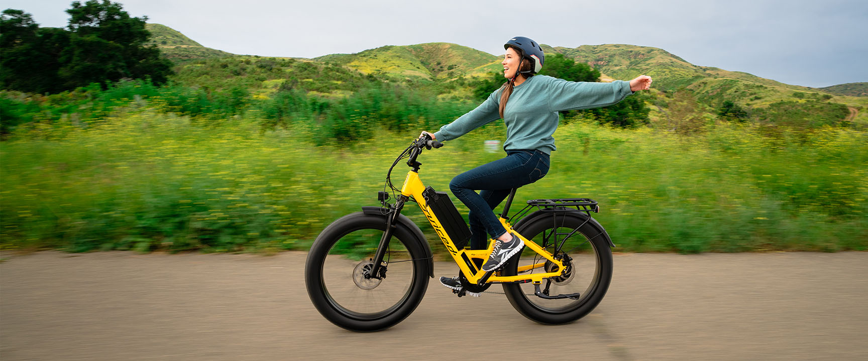Girl on yellow bike